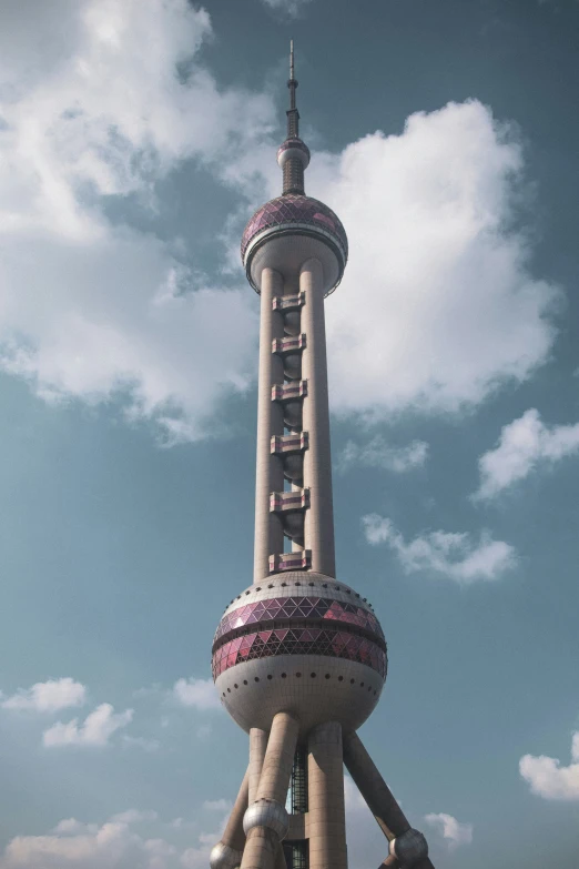 the oriental structure stands tall on a cloudy day