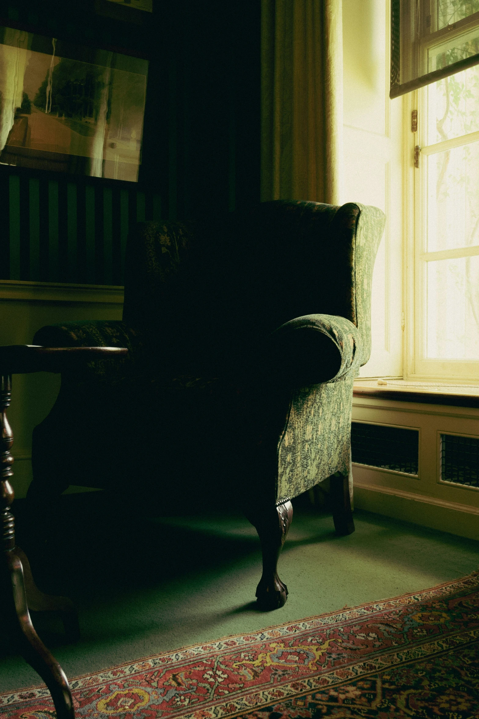 a chair is in the corner of an old room