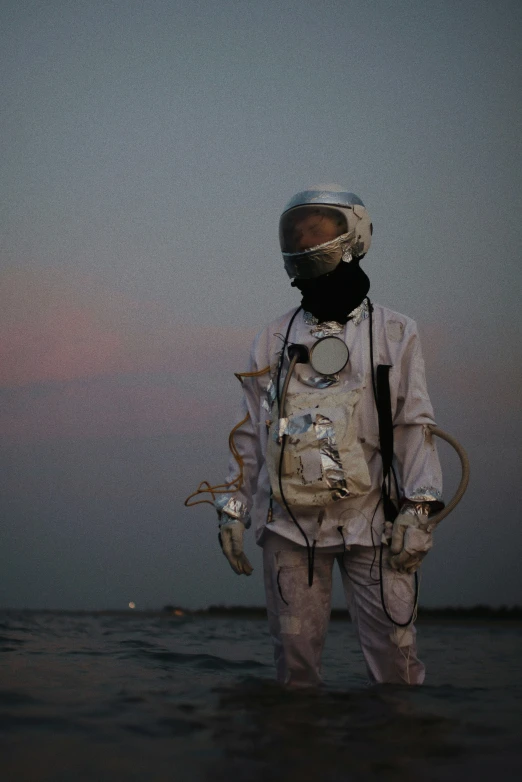 a man with some very strange gear by the water