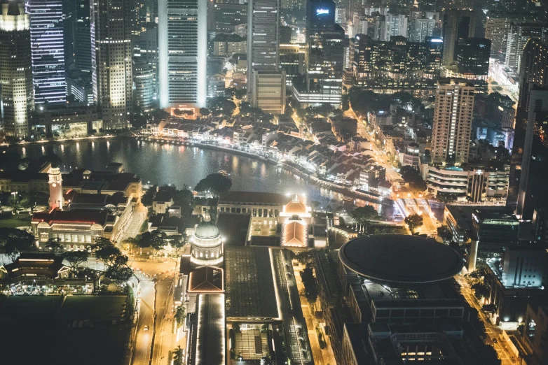 a picture taken at night shows several buildings near water