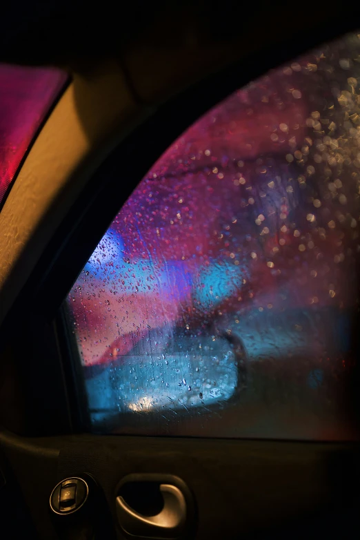 a vehicle with rain drops coming from the inside