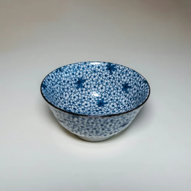 a blue and white bowl on a table