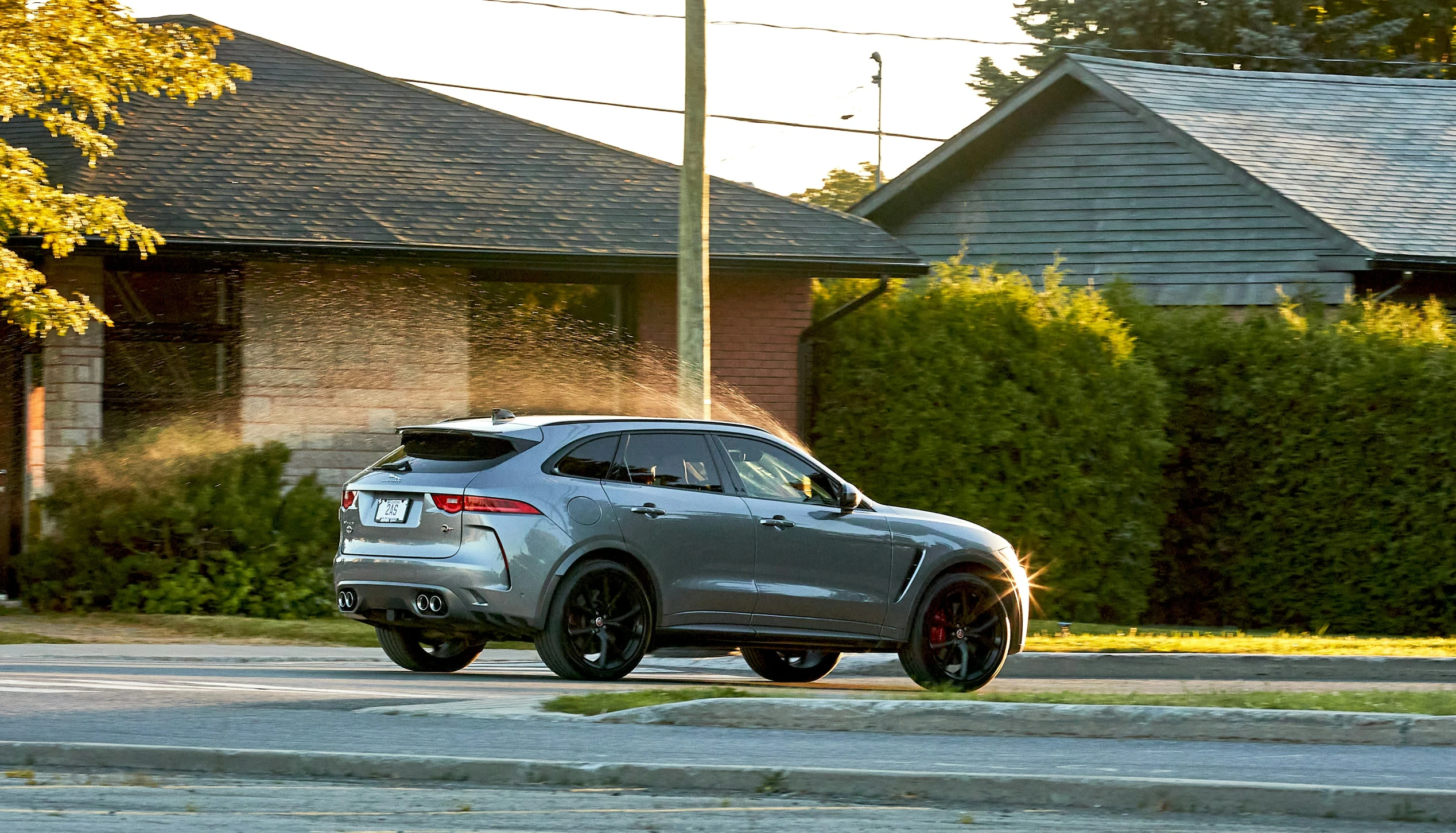 a silver vehicle parked in front of a house