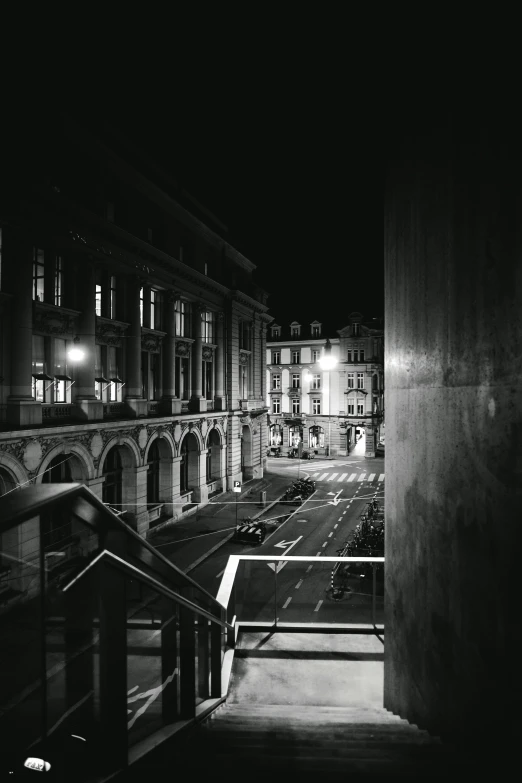 the staircase is lined with buildings and street lights