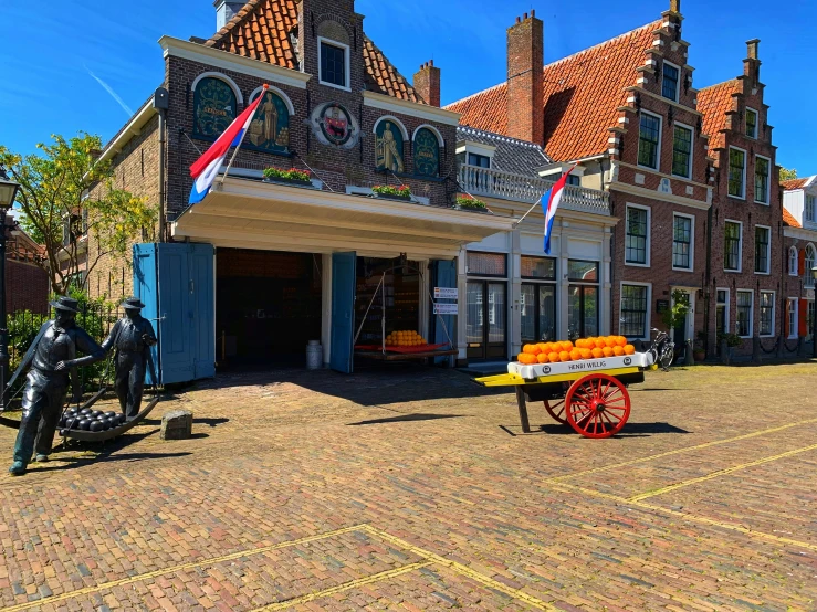 some type of building that has many windows and some flags