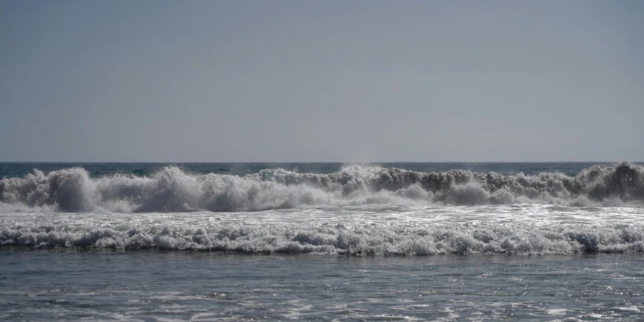 a po of a surf boarder riding a wave