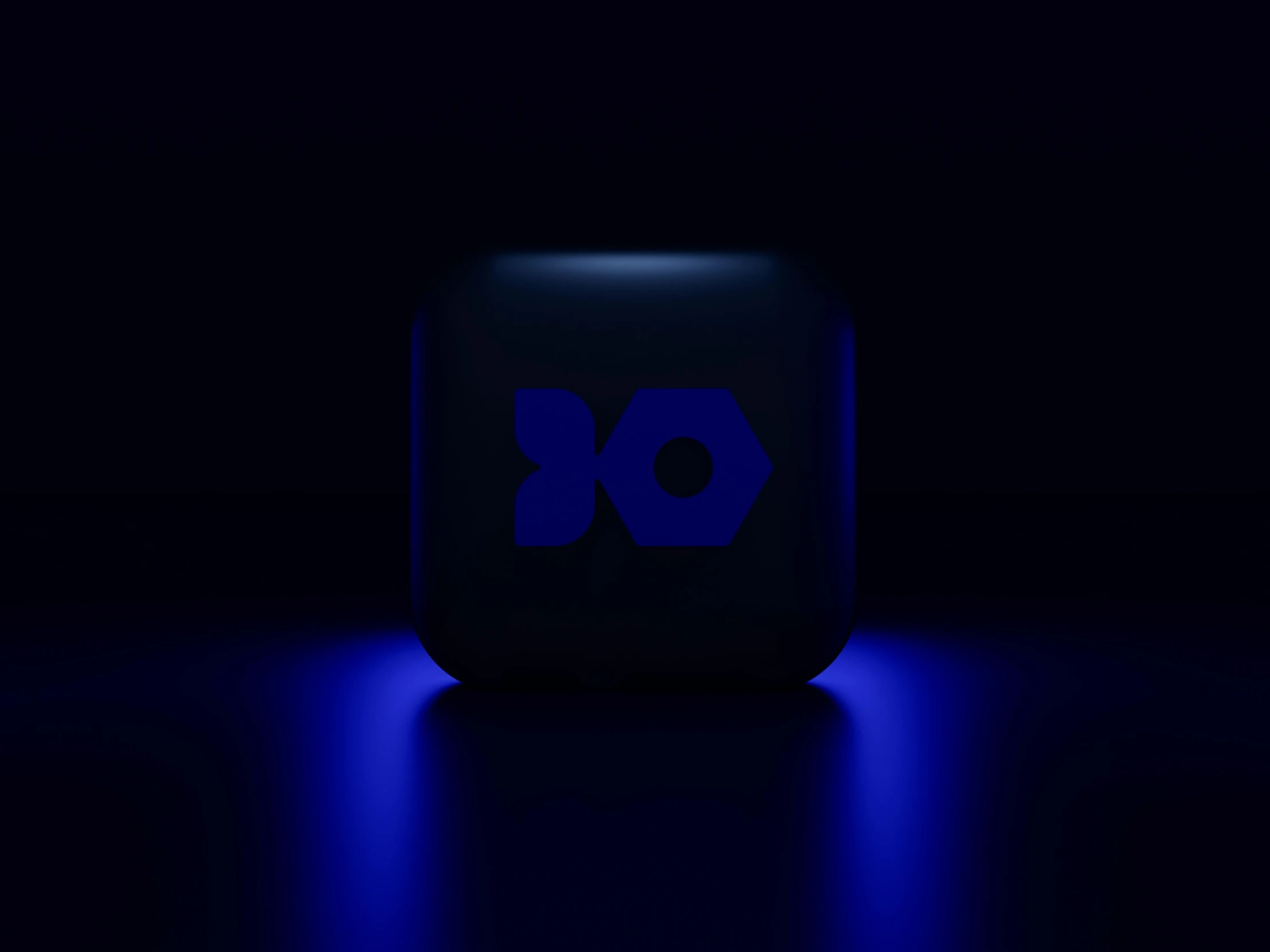 a dark room has a glowing blue logo on the back of it