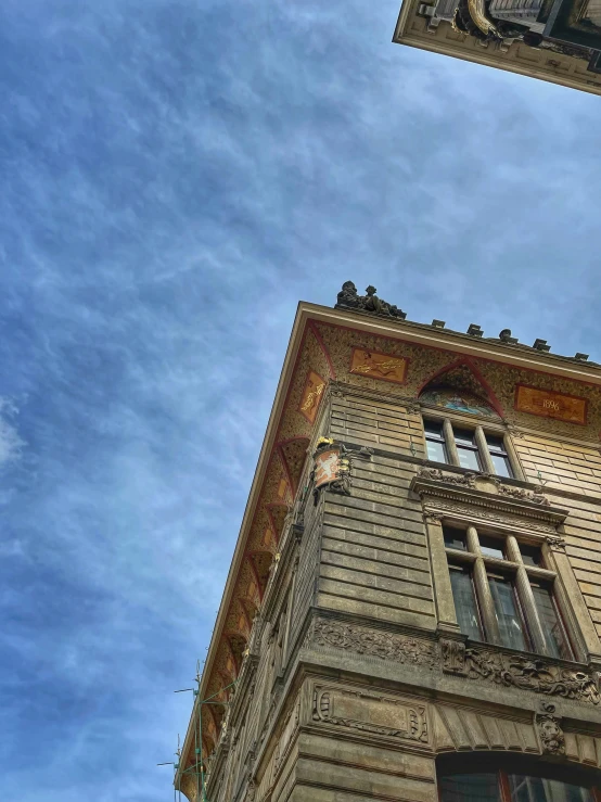 a tall building with some balconies on top of it