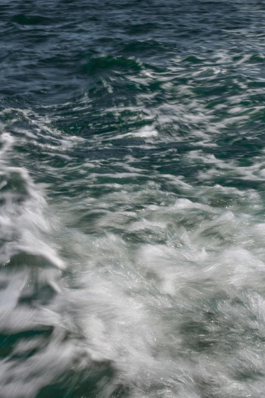 a person that is riding a surfboard on some water