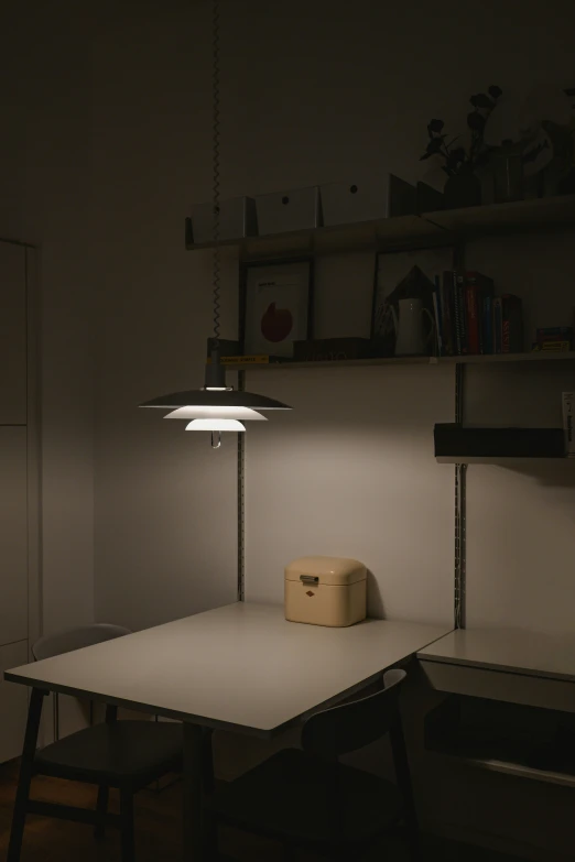 a table and bench in a dimly lit room