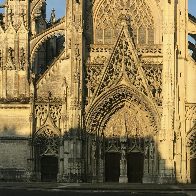 a gothic cathedral with a tall tower that has several windows