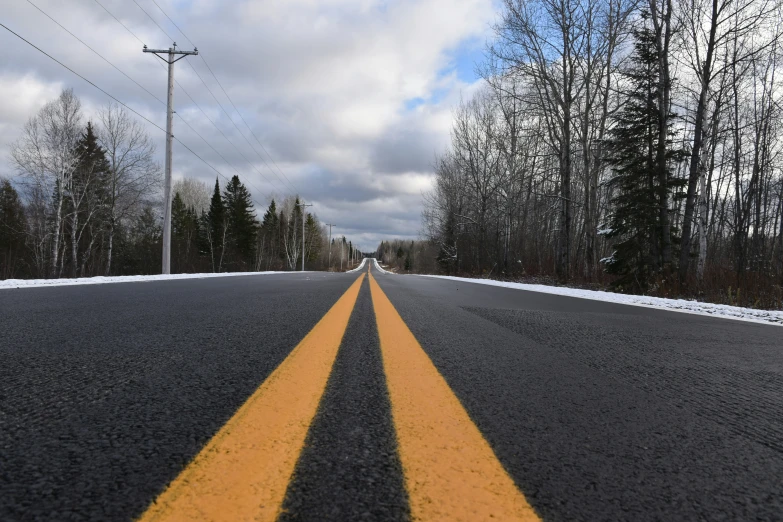 the yellow lines are on the black road