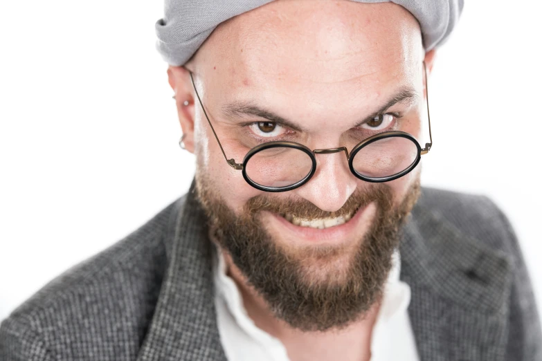 a close up of a person wearing glasses and a hat