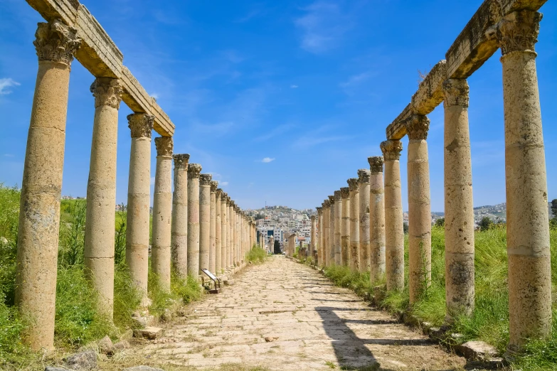 the remains of roman ruins are shown along a narrow dirt path