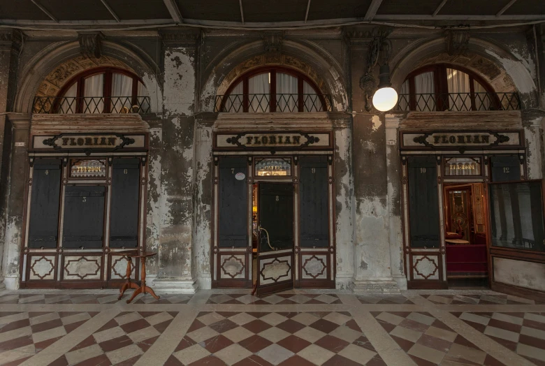 a room has an open doorway and ornate windows