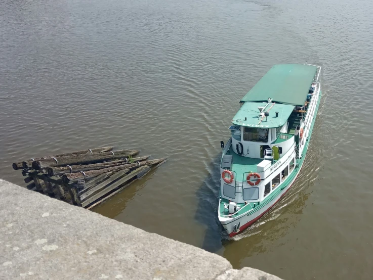 a ship in a body of water near the shore