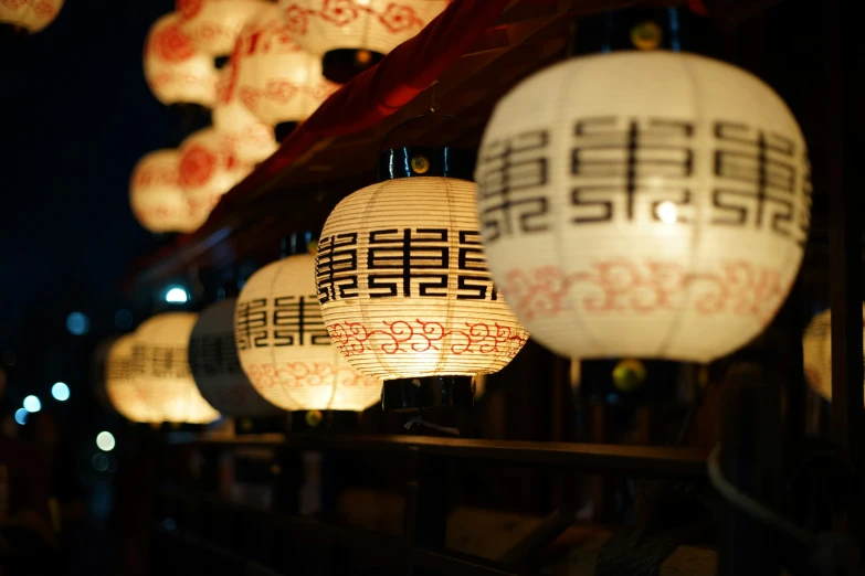 lanterns hanging from the ceiling in an oriental restaurant