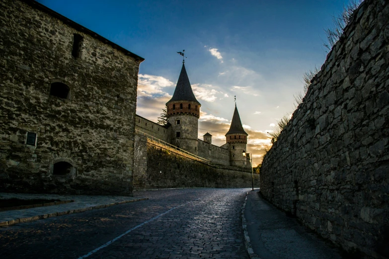 the tower of an old stone building with many turrets