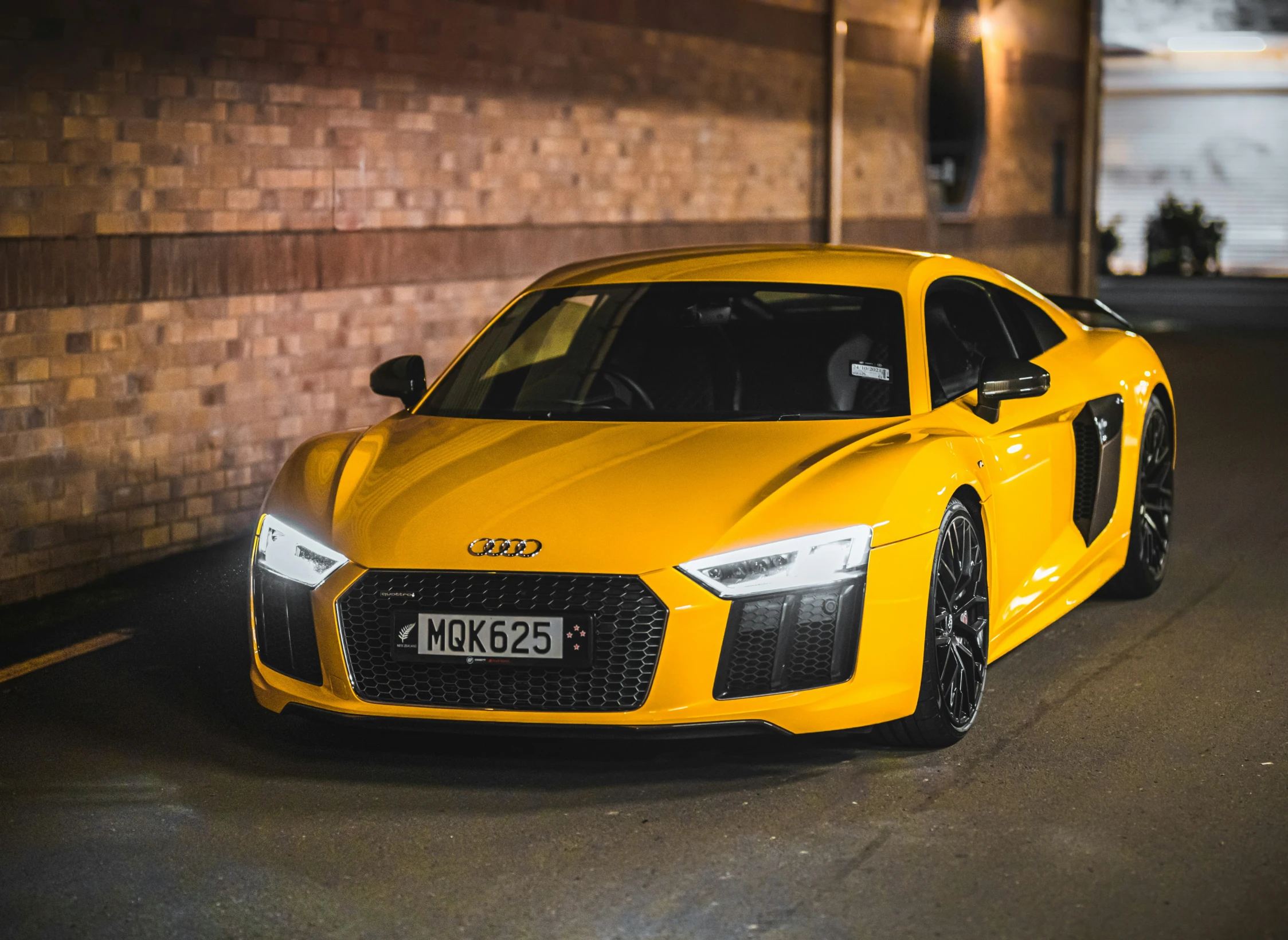 a yellow audi gts on the street