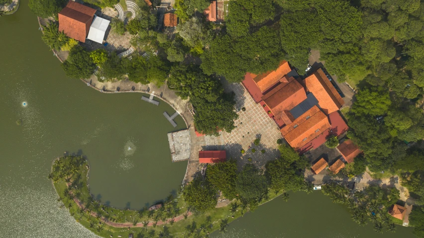 an aerial view of a house surrounded by trees