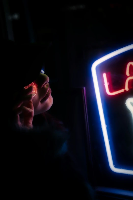 there is a neon sign with a writing on it