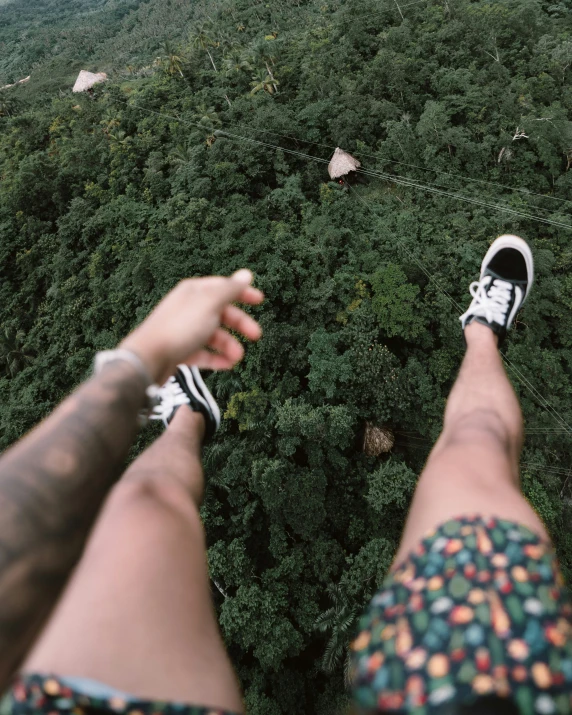 feet up in a sky view of a forest