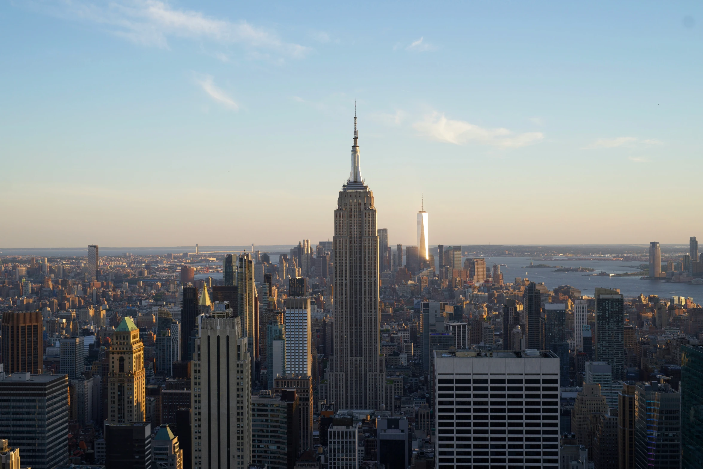 the cityscape is covered in skyscrs, and skyscrs rise above the water