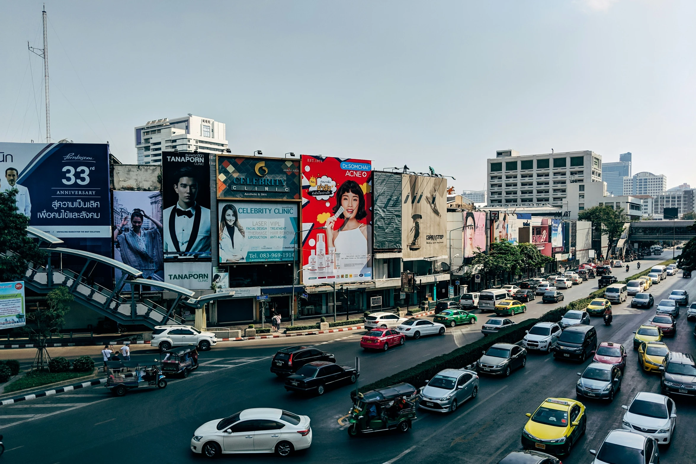 an overview of a busy city street filled with lots of traffic