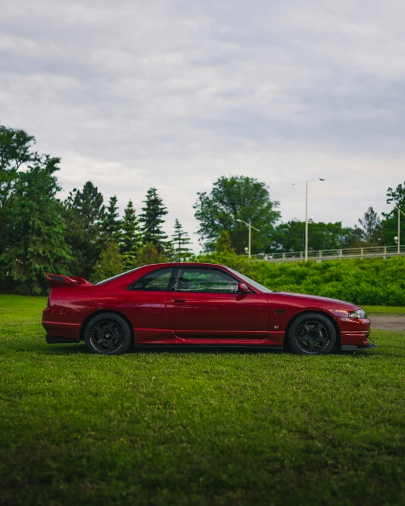 a red sports car parked on grass