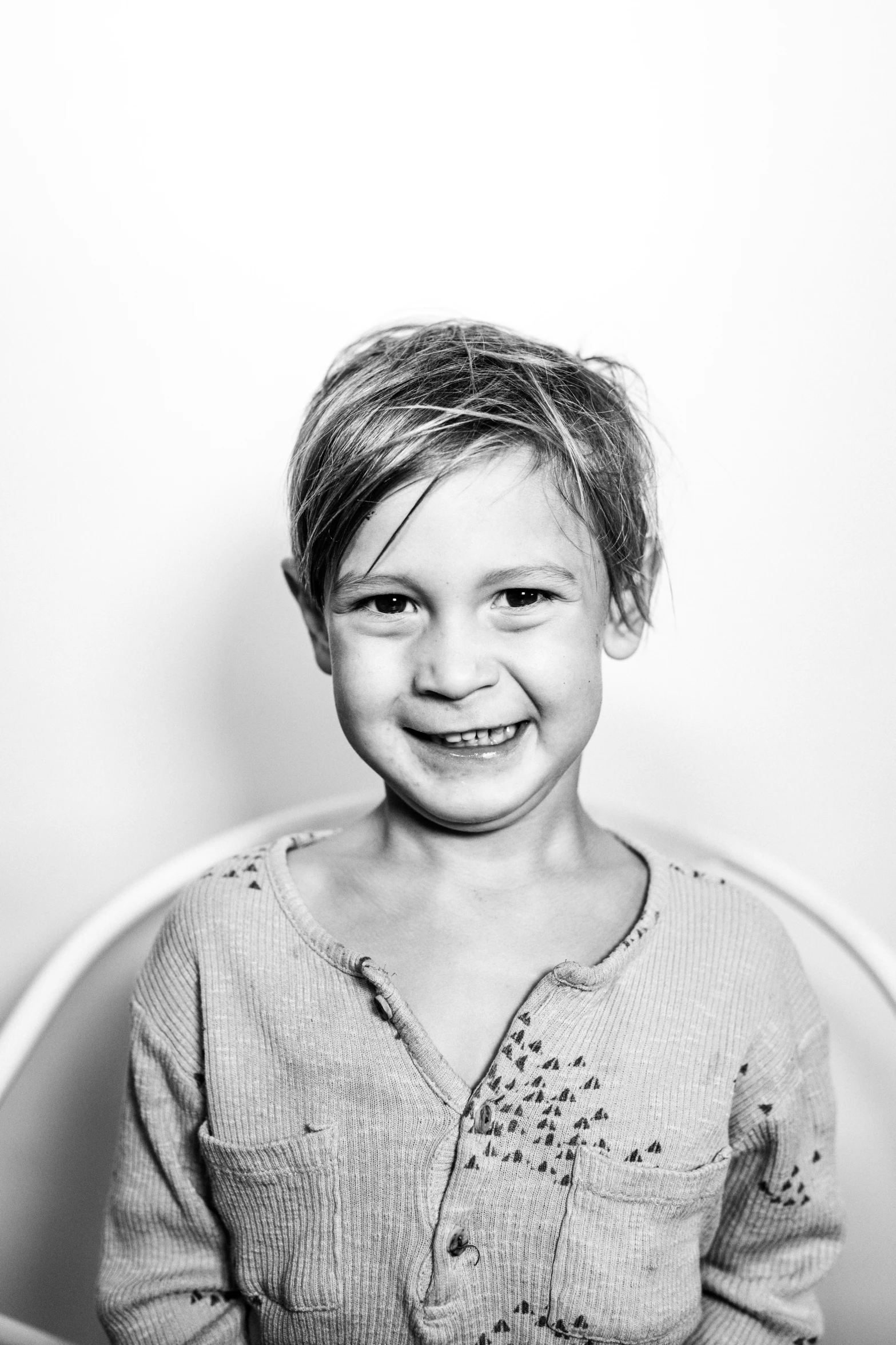 black and white pograph of a little girl smiling