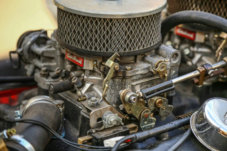 a small engine with a black seat attached