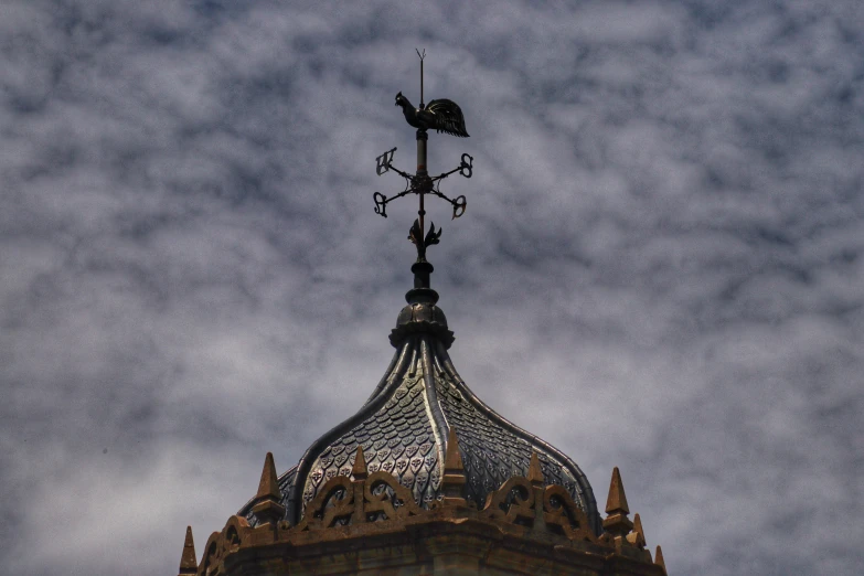 an ornate building with the top of a tower