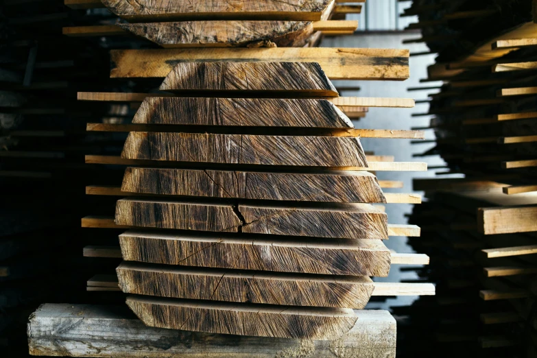 some wood logs stacked up on top of each other