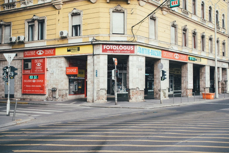 a cross walk in front of two businesses