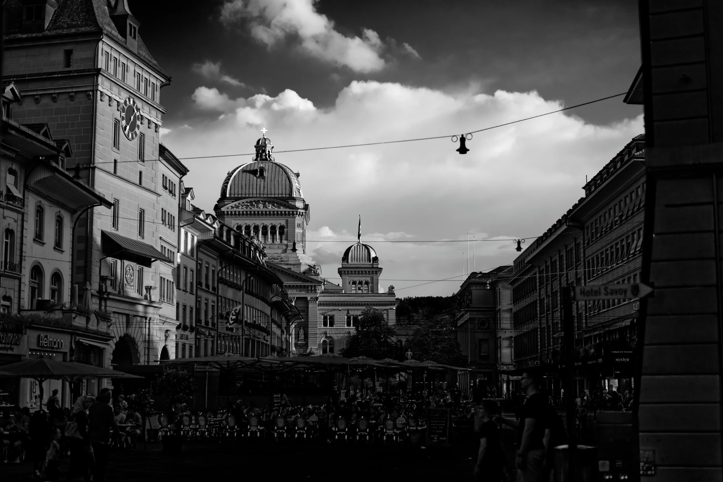 black and white pograph of some buildings in the city