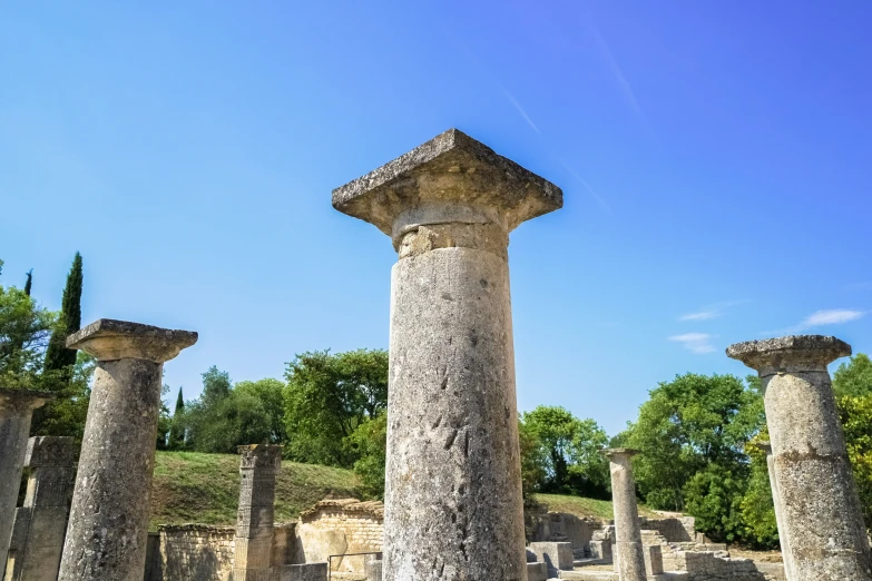 the view shows an ancient structure with many columns