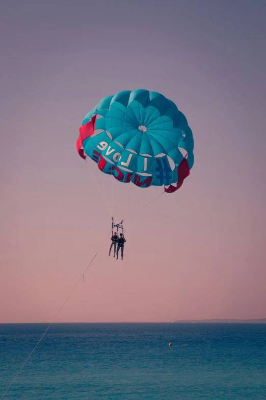 a person is parasailing in the ocean during the day