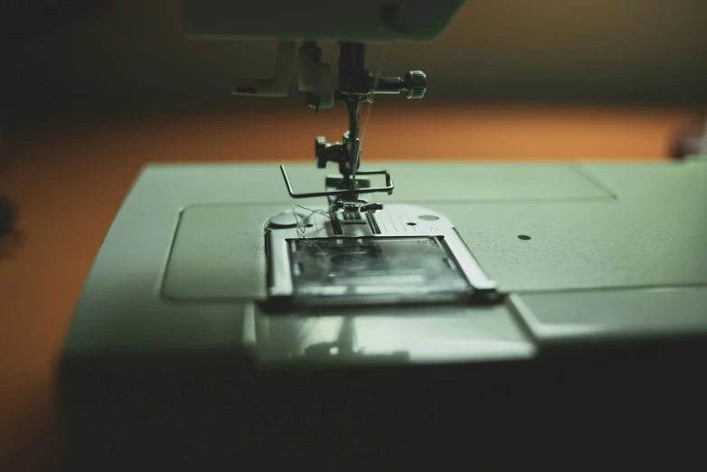 an electronic sewing machine has two small ons and one smaller on