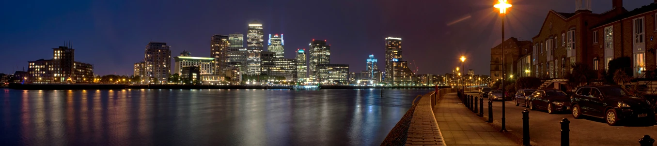 lights reflect off of the city's modern skyline