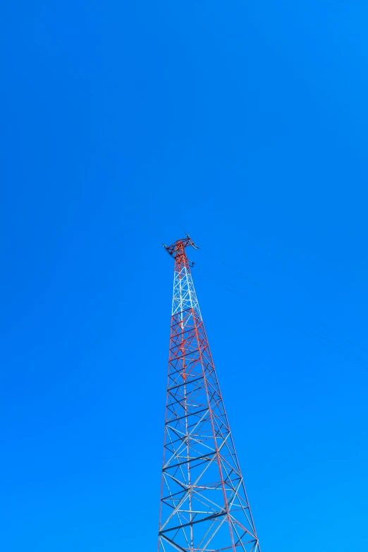 a blue sky with a telephone pole and power lines