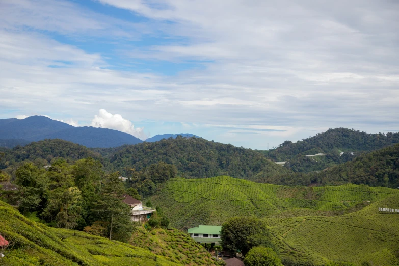 mountains and greenery covered countrysides sit in the distance