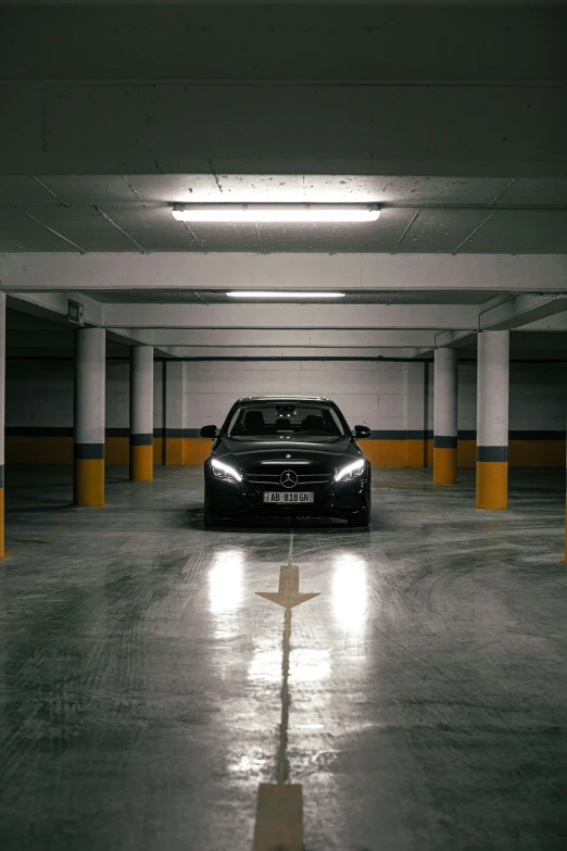 a car parked in the parking garage next to the floor