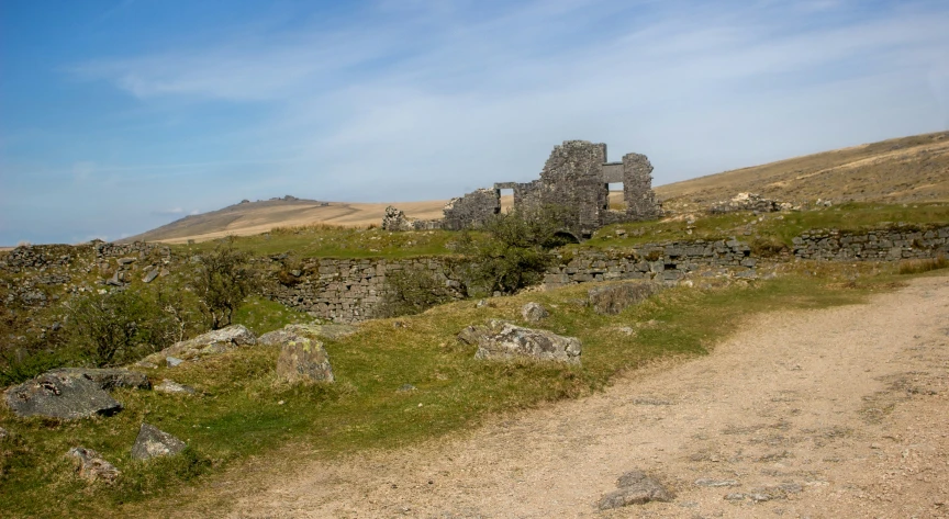 an old abandoned church standing on the side of a hill