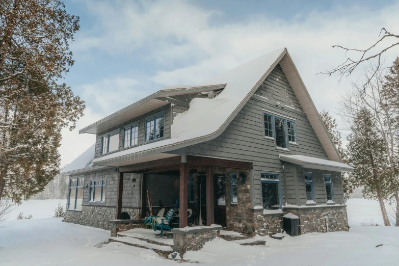 a log house with lots of snow in the snow