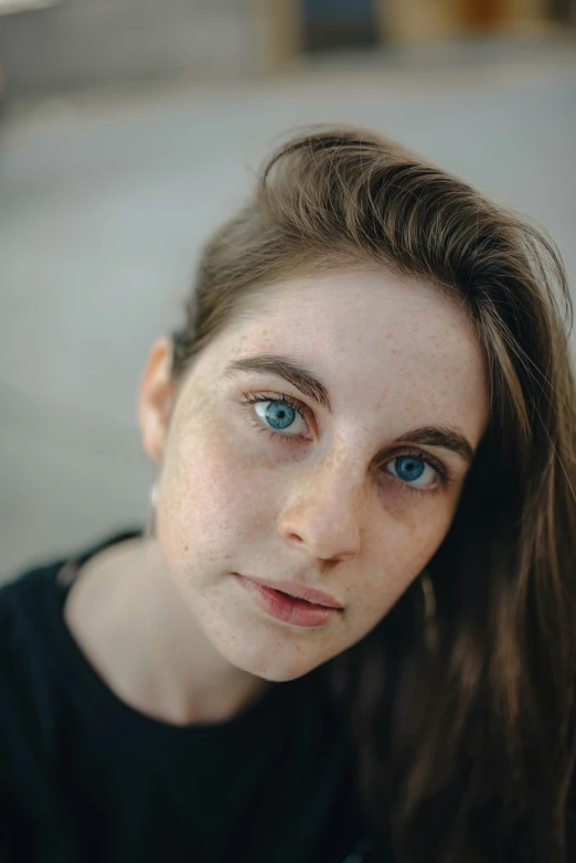 a close up image of a woman with blue eyes