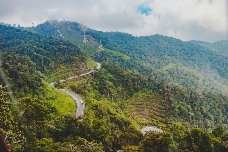 a winding road in the middle of a mountain