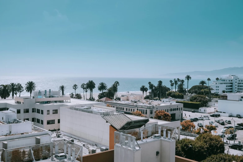 an aerial view of a city and the ocean