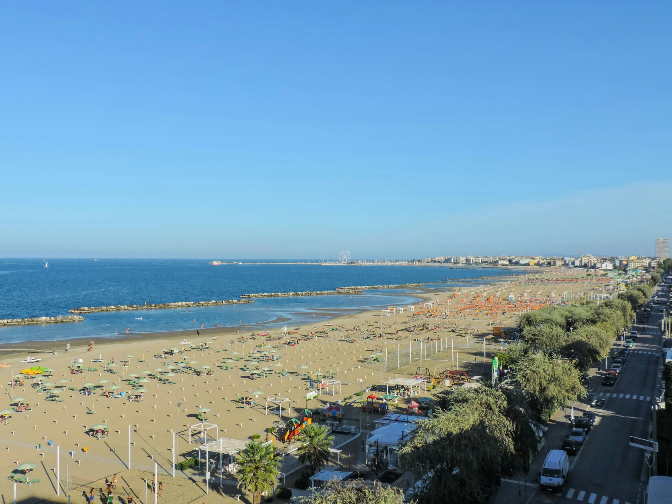 there are many people walking on the beach