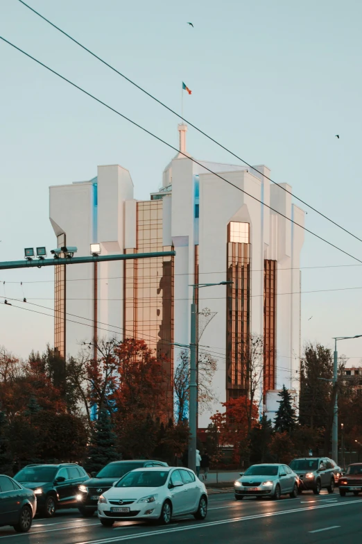 cars parked in line next to a building