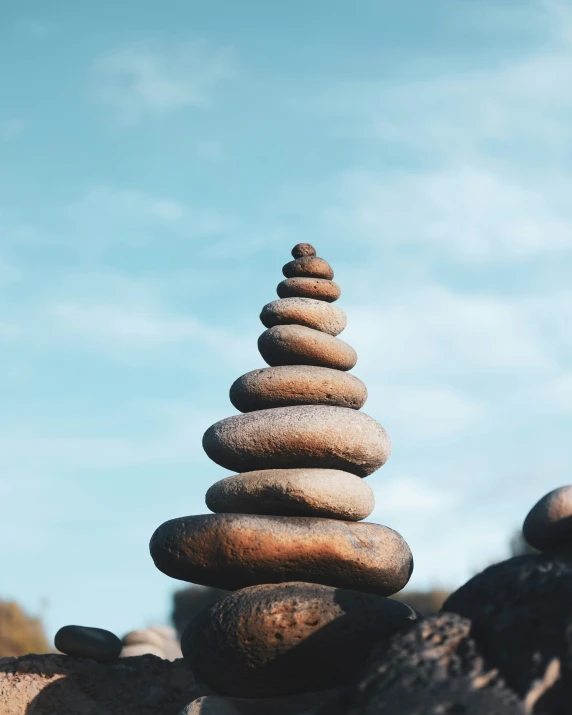 a pile of rocks stacked high in the sky